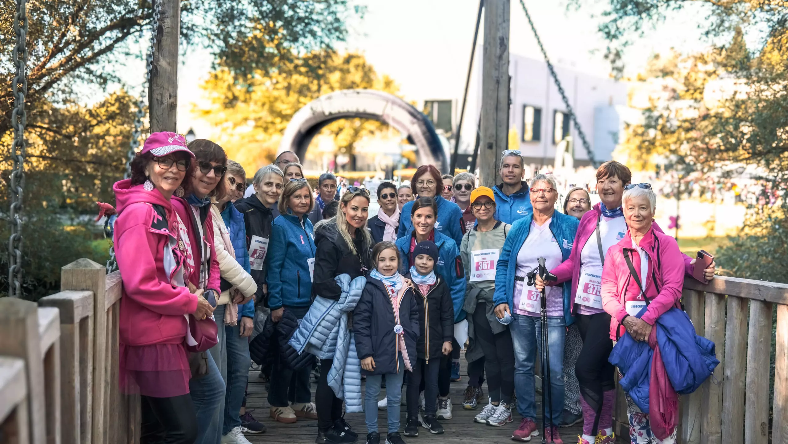 A group of ALGSO members posing before the finish line at an event.