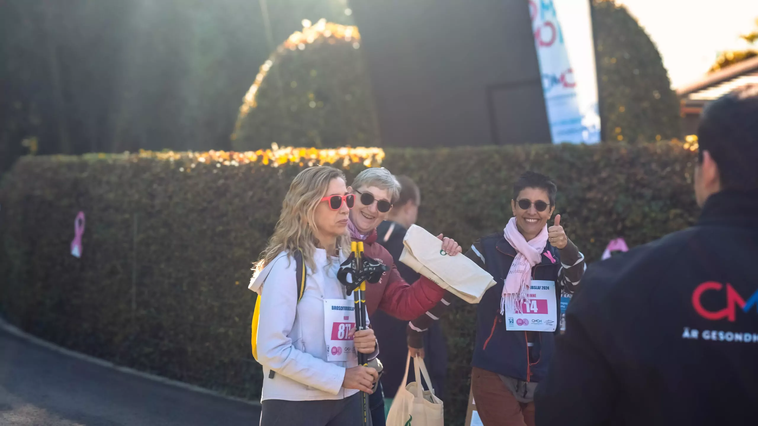 A group of ALGSO members smiling as the cross the finish line of the Broschtkriibslaf 2024
