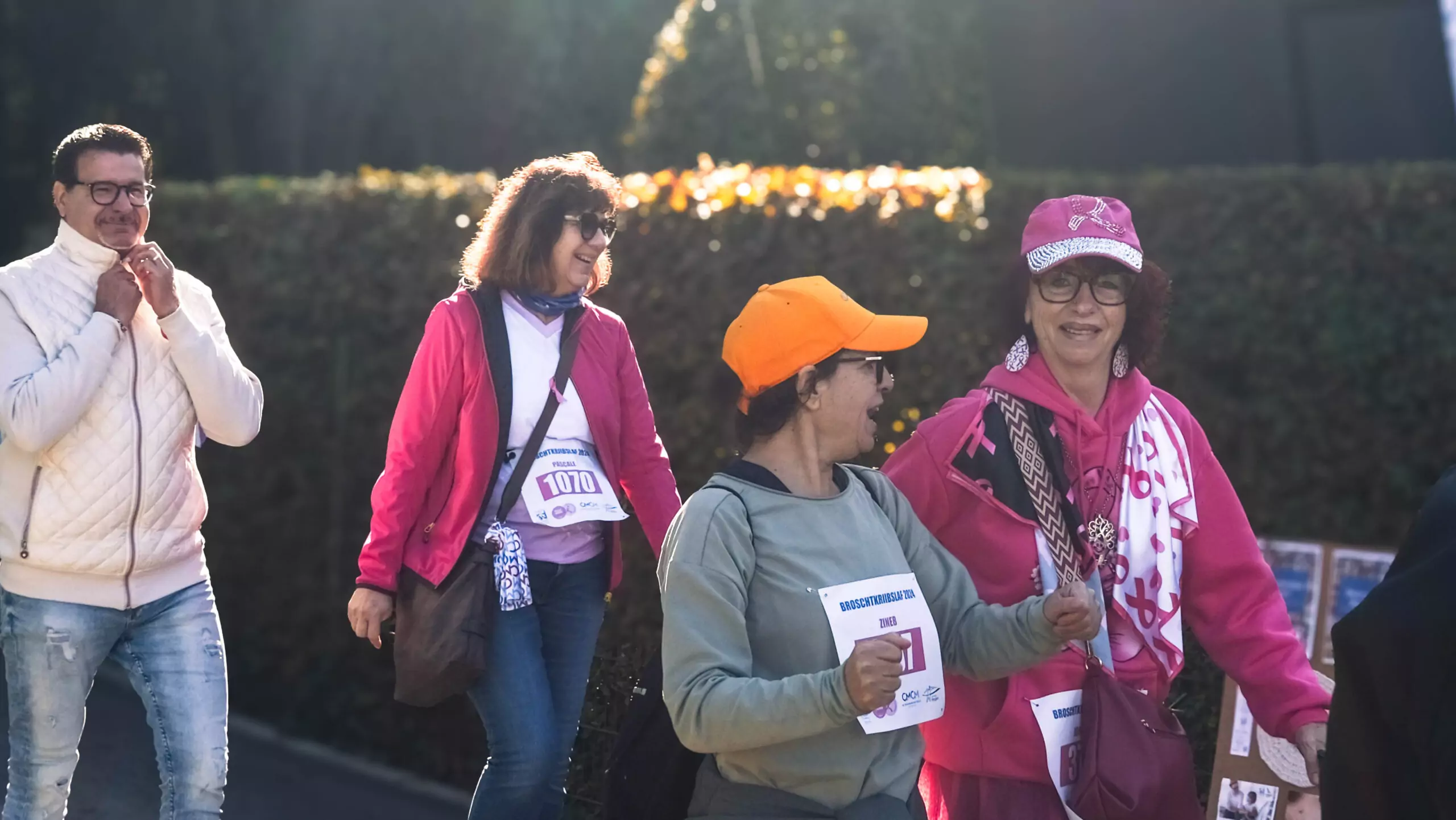 A group of ALGSO members smiling and chatting as they cross the finish line of the Broschtkriibslaf 2024