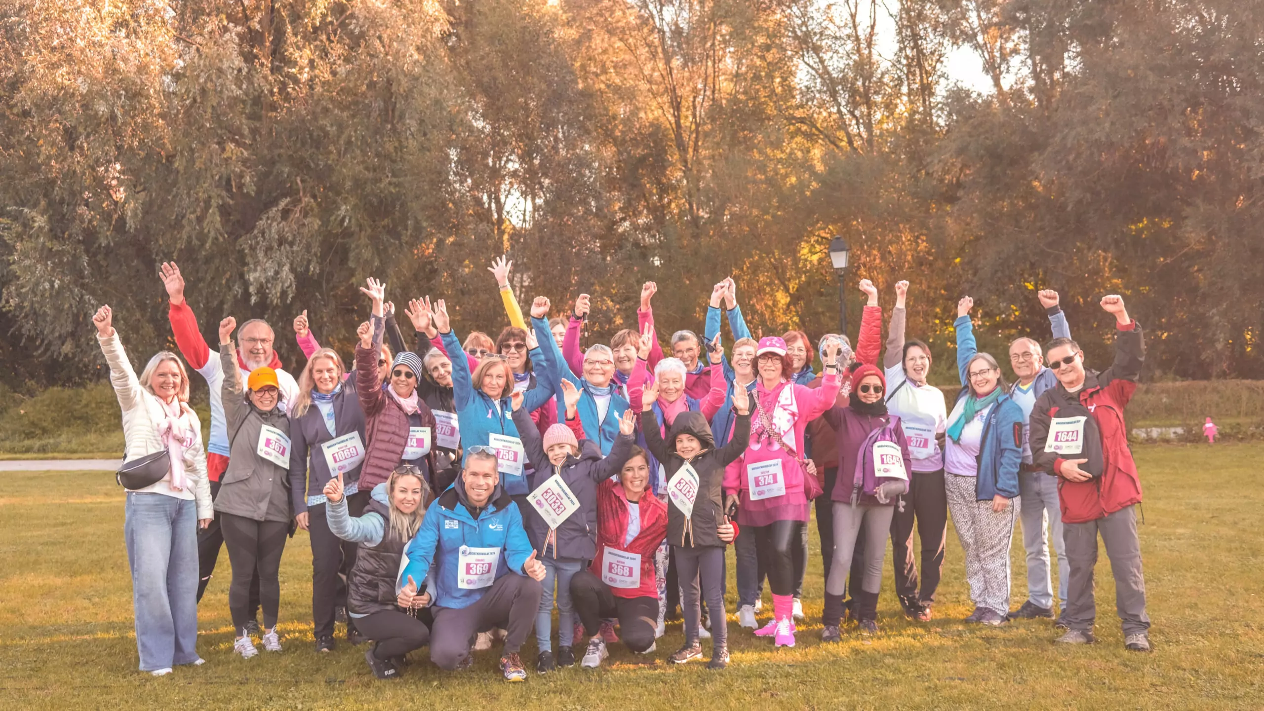 a group of ALGSO members posing for a photo with their fists raised in unity.