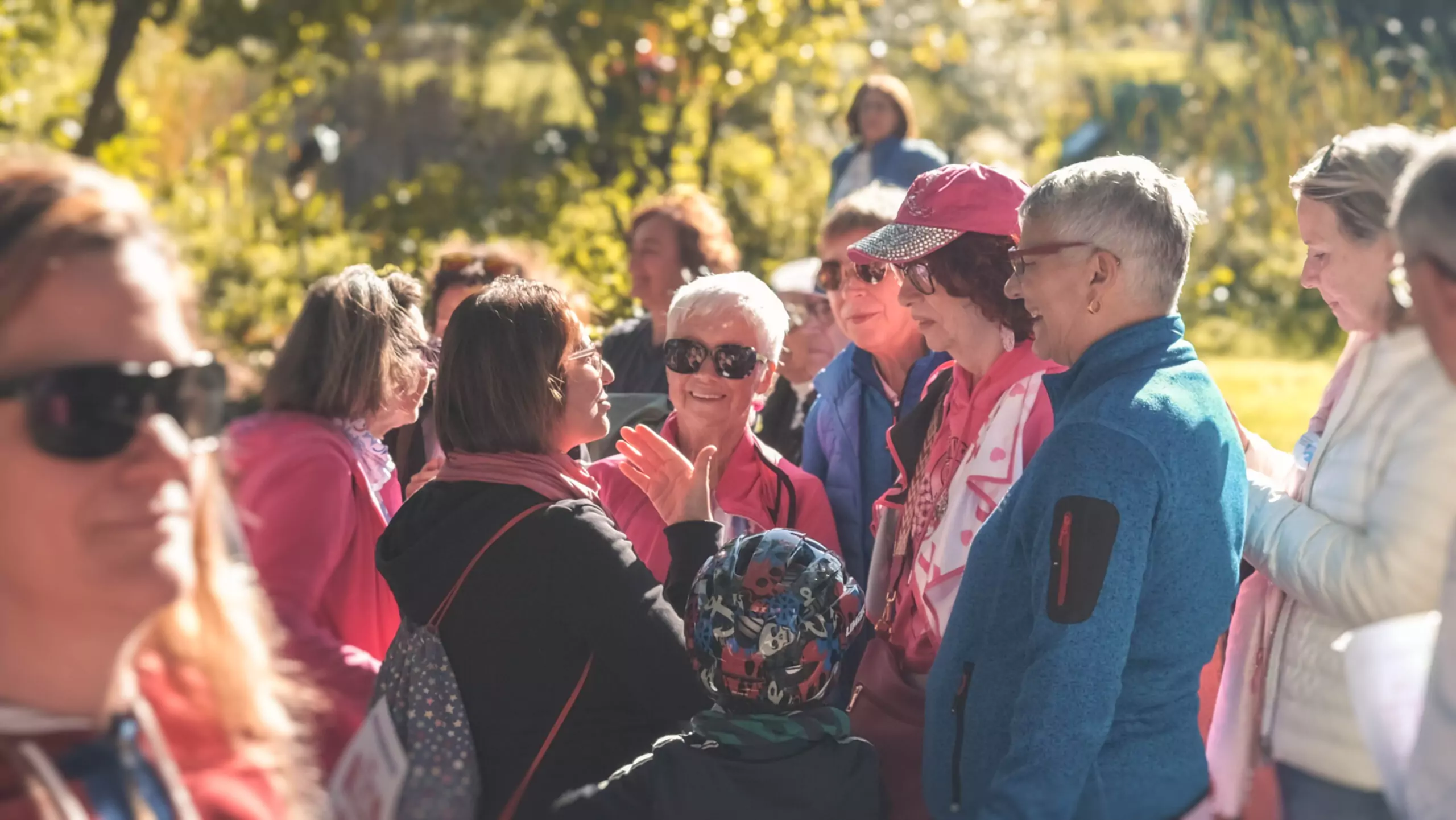 A group of ALGSO members smiling and chatting at the Broschtkriibslaf 2024