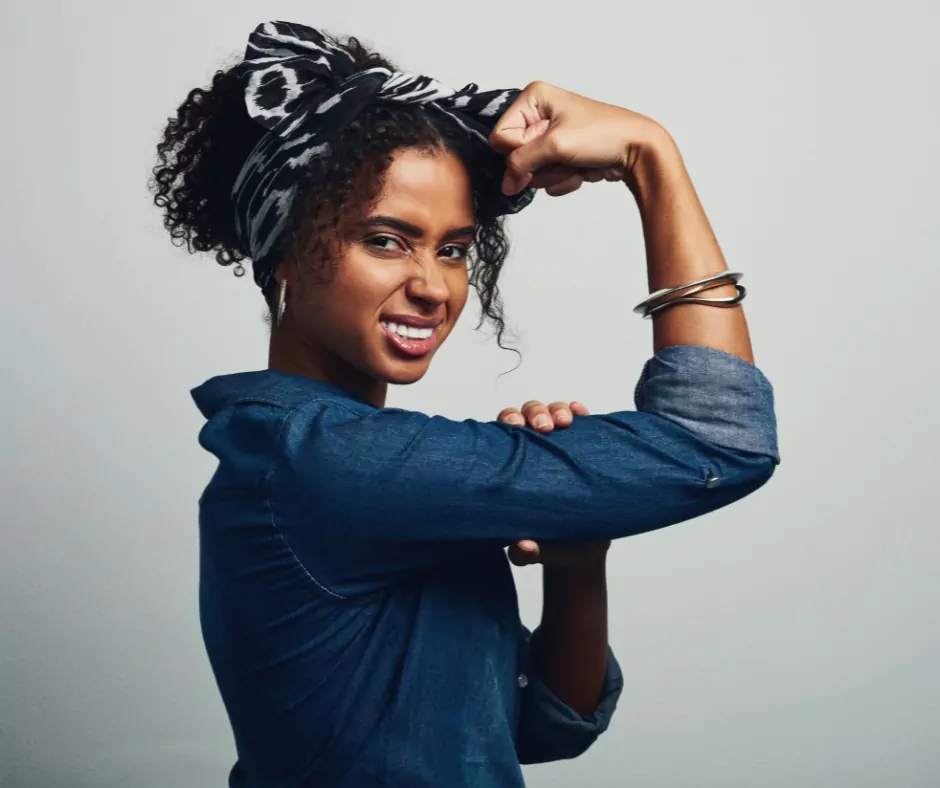 an empowered woman flexing her arm